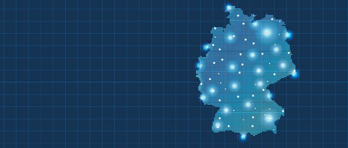 The picture shows a blue digital map of Germany with blinking city-dots.